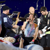 No need to shove, unless there's no room on the couch; for those who aren't heading to Glastonbury this week, there are plenty of other ways to follow the festival comprehensively without ruining your favourite pair of Hunters (Credit: Getty/Canva)