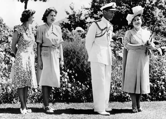 Princess Elizabeth poses with her father, King George VI, her mother Queen Elizabeth and her sister Princess Magaret in February 1947 in Cape Town during her first official state visit to South Africa. - The Queen and Princesses are British fashion ambassadors on this trip, and as such have benefited from special textile points granted by the Department of Trade. (Photo by Sport and General Press Agency Limited / AFP) (Photo by -/Sport and General Press Agency L/AFP via Getty Images)