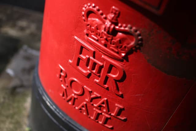 The Royal cypher is displayed on a Royal Mail post box. (Photo by Peter Macdiarmid/Getty Images)