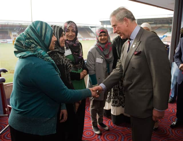 Charles, at Turf Moor in 2010, speaks to young people who have participated in programmes run by the Prince’s charities