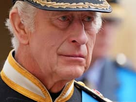 King Charles III follows the coffin of Queen Elizabeth II as it travels inside Windsor Castle on September 19. 