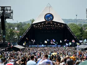 Crowds of festival-goers watch Tom Odell perform on the Pyramid Stage during day three of Glastonbury Festival 2019