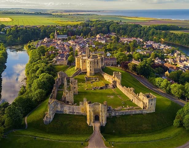 A view over Warkworth Castle and the surrounding village which has topped the list of British villages which have risen in value for 20 years straight.