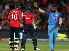 Alex Hales of England congratulates  Jos Buttler of England on his 50th run during the ICC Men's T20 World Cup Semi Final match between India and England at Adelaide Oval on November 10