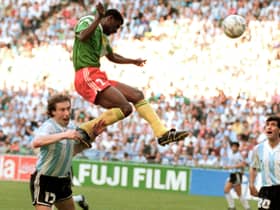 Forward Francois Omam-Biyick from Cameroon scores with a header as Argentinian defenders Nestor Lorenzo (L) and Juan Simon look on during the opening match of Italia 90  (STAFF/AFP via Getty Images)