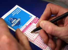  A punter fills out a National Lottery ticket.