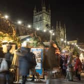 Christmas shoppers browse stalls at the traditional Christmas market in Bath.