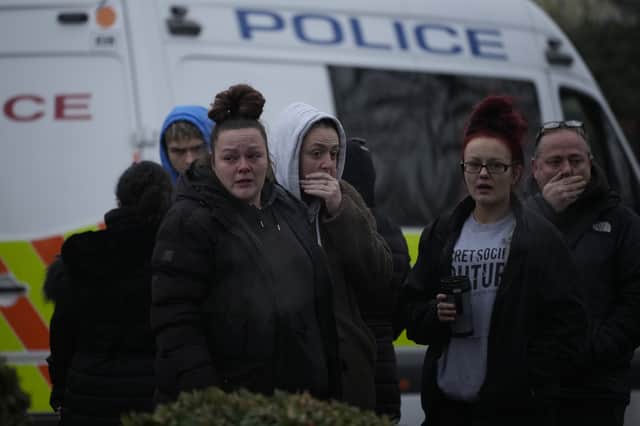 Mourners visit the scene at Babbs Mill Lake.