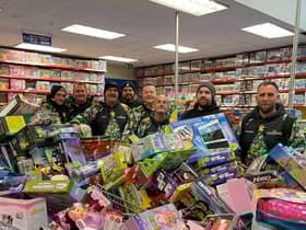Reese, far right, and his team with some of hundreds of toys they bough from Smyth's Toy Shop