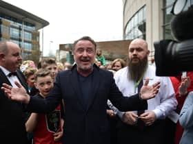 Michael Flatley, star of Riverdance and Lord of the Dance is mobbed by fans as he makes an appearance during the opening day of the World Irish Dancing Championships at the Waterfront Hall on April 10, 2022 in Belfast