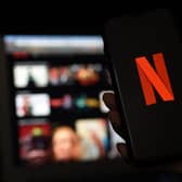 In this photo illustration a computer and a mobile phone screens display the Netflix logo on March 31, 2020 in Arlington, Virginia. (Photo by Olivier DOULIERY / AFP) (Photo by OLIVIER DOULIERY/AFP via Getty Images)