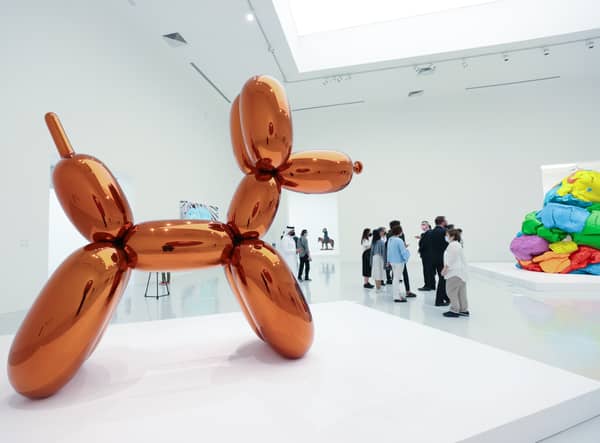 A woman accidentally destroyed a Jeff Koons glass sculpture believing it to be a balloon dog.