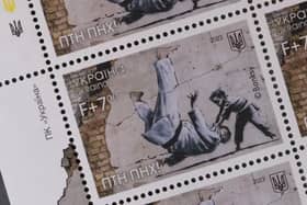 Ukraine postage stamps depicting a Banksy mural