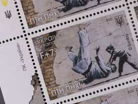 Ukraine postage stamps depicting a Banksy mural