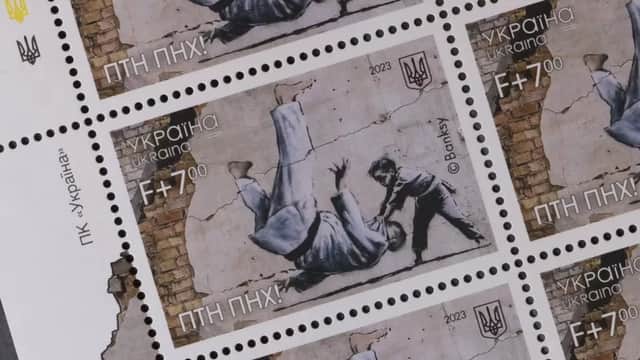 Ukraine postage stamps depicting a Banksy mural