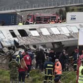 Police and emergency crews search wreckage after a train accident in the Tempi Valley near Larissa, Greece, March 1, 2023. - At least 32 people were killed and another 85 injured after a collision between two trains caused a derailment near the Greek city of Larissa late at night on February 28, 2023, authorities said. A fire services spokesman confirmed that three carriages skipped the tracks just before midnight after the trains -- one for freight and the other carrying 350 passengers - collided about halfway along the route between Athens and Thessaloniki. (Photo by Sakis MITROLIDIS / AFP) (Photo by SAKIS MITROLIDIS/AFP via Getty Images)