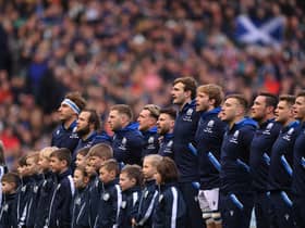The Scotland team sing the national anthem during a Six Nations Rugby match at Murrayfield Stadium