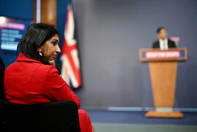 Suella Braverman listens on as prime minister Rishi Sunak announces the Illegal Migration Bill