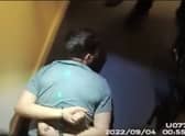 Thomas Cashman is arrested by armed police.