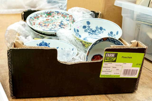 The cardboard box containing a collection of dishes including Chinese ceramics which sold for a total of £112,000.