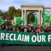 Protesters march into central London at a demonstration by the climate change protest group Extinction Rebellion, on October 16, 2022. Credit: Isabel Infantes/AFP.