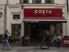 LONDON, ENGLAND - AUGUST 31: Customers sit outside a Costa Coffee store on August 31, 2018 in London, England. Coca-Cola Co. is to buy the U.K. chain Costa Coffee for £3.9 billion GBP, ($5.1 billion USD). (Photo by Dan Kitwood/Getty Images)