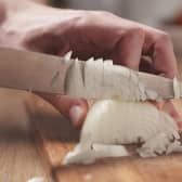 Putting a wet paper towel next to the chopping board supposedly helps stop your eyes from watering (Photo: Adobe)