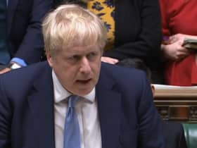 Prime Minister Boris Johnson delivers a statement to MPs in the House of Commons on the Sue Gray report (PA)