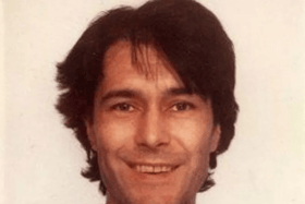 Human remains found in Welsh woodland have been confirmed to be that of Russell Scozzi, a computer expert who was last seen 20 years ago. 