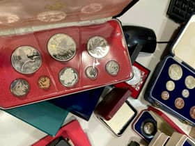 The secret collection, which includes a William III crown dating back to 1696, could fetch in excess of £17,500 at auction.