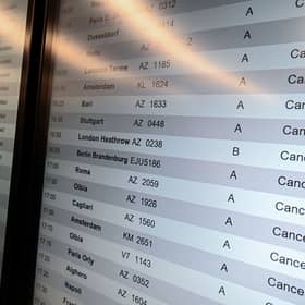 A screen shows cancelled flights at Milan Linate Airport in Milan, Italy on October 21, 2022 due to strike (Photo by Piero Cruciatti/Anadolu Agency via Getty Images)