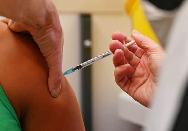 A member of the public receives a dose of the Pfizer BioNtech vaccine at a vaccination centre (Getty Images)