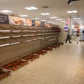 A shopper peruses near-empty bread shelves at a supermarket in the centre of York, northern England, during the first lockdown (Getty Images)
