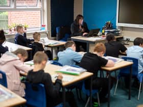 Year five pupils, with their own individual stationery and books in plastic folders, work at their desks at Willowpark Primary Academy in Oldham (Photo by OLI SCARFF/AFP via Getty Images)