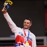 Gold medalist Matthew Walls of Team Great Britain, poses on the podium during the medal ceremony after the Men's Omnium final of the track cycling (Photo by Tim de Waele/Getty Images)
