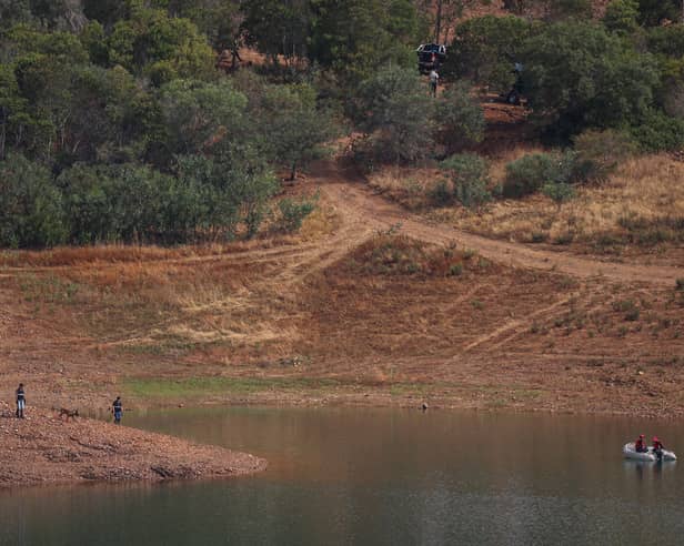 Portuguese firefighterOfficials are seen during a new search operation amid the investigation into the disappearance of Madeleine McCann in the Arade dam, in Silves, near Praia da Luz, on 23 May, 2023.