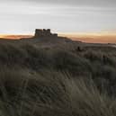 The sun sets behind Bamburgh Castle (Photo: Dan Kitwood/Getty Images)