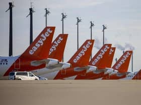 Easyjet planes are seen parked at the "Berlin Brandenburg Airport Willy Brandt" in Schoenefeld, southeast of Berlin (Photo by ODD ANDERSEN/AFP via Getty Images)
