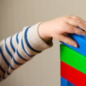 Child plays with building blocks.