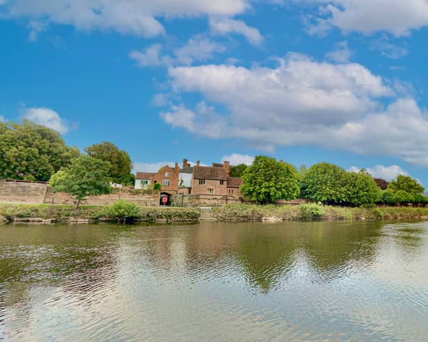 A man was arrested on suspicion of murder after a woman’s body was found in the river in Wales.
