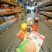 A shopping trolley filled with groceries from Aldi, which has been named the UK’s cheapest supermarket for 12 months in a row.