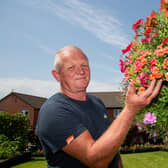 Shaun Schroeder, 59, plants around 140 hanging baskets and fence planters each year. 