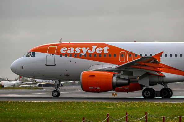 EasyJet has defended its policy of letting its plane crew include their preferred pronouns on name badges despite criticism. (Photo by Horacio Villalobos#Corbis/Getty Images)