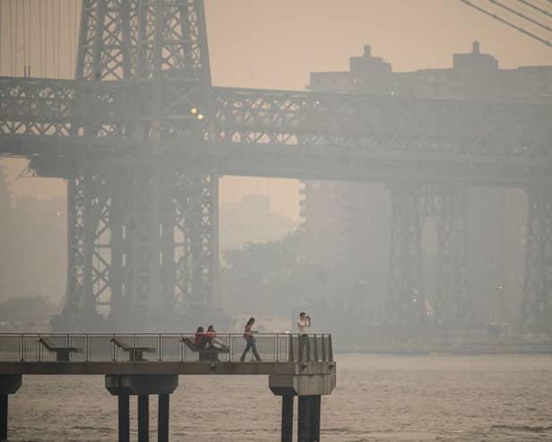 The New York city skyline and east river shrouded in smoke in Brooklyn as smoke from the hundreds of wildfires blazing in eastern Canada drifted south (Photo: Getty Images)
