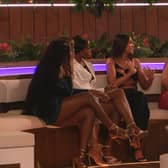The Love Island girls sat around the fire pit with new bombshell Mal
