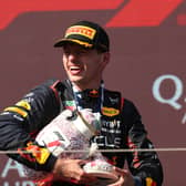 Max Verstappen holds the broken Hungarian Grand Prix trophy 