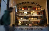 A pedestrian walks past a branch of a Patisserie Valerie cafe in London on January 23, 2019.