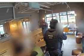 armed police arrest man in Starbucks