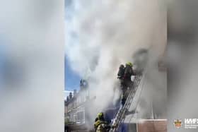 Firefighter rescues man from burning flat.
