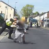 Police officer tackles suspected bike thief to ground.